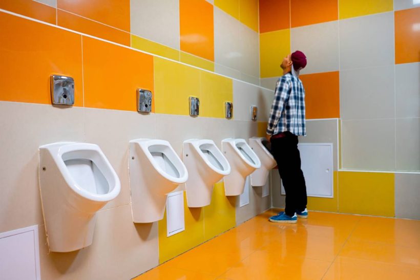 a-young-man-in-the-public-toilet-standing-next-to-2025-01-27-04-05-15-utc (1)