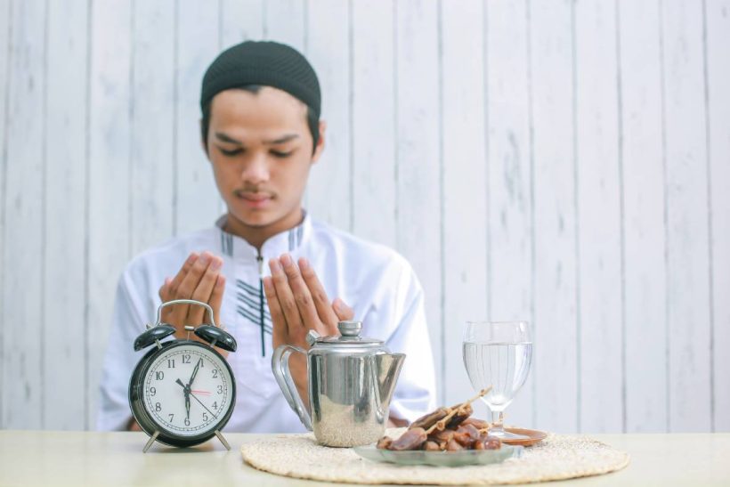 asian-man-praying-before-eat-at-iftar-time-2025-01-28-00-32-19-utc (1)