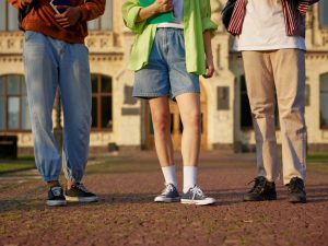 group-of-smart-students-standing-outdoors-at-campu-2024-11-26-05-39-23-utc