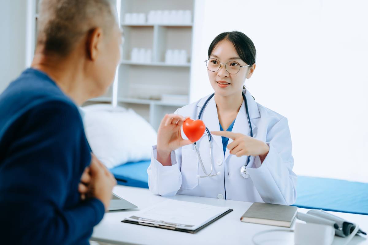 Serious Asia female doctor using clipboard is delivering great news talk discuss results or symptoms with female patient in clinic or hospital